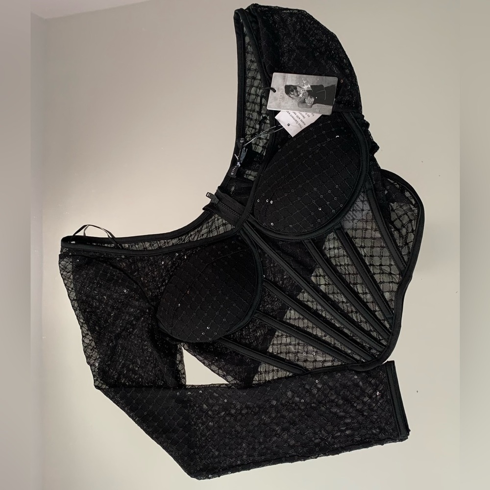 Beautiful sparkly, corset styled crop top with built in cups.